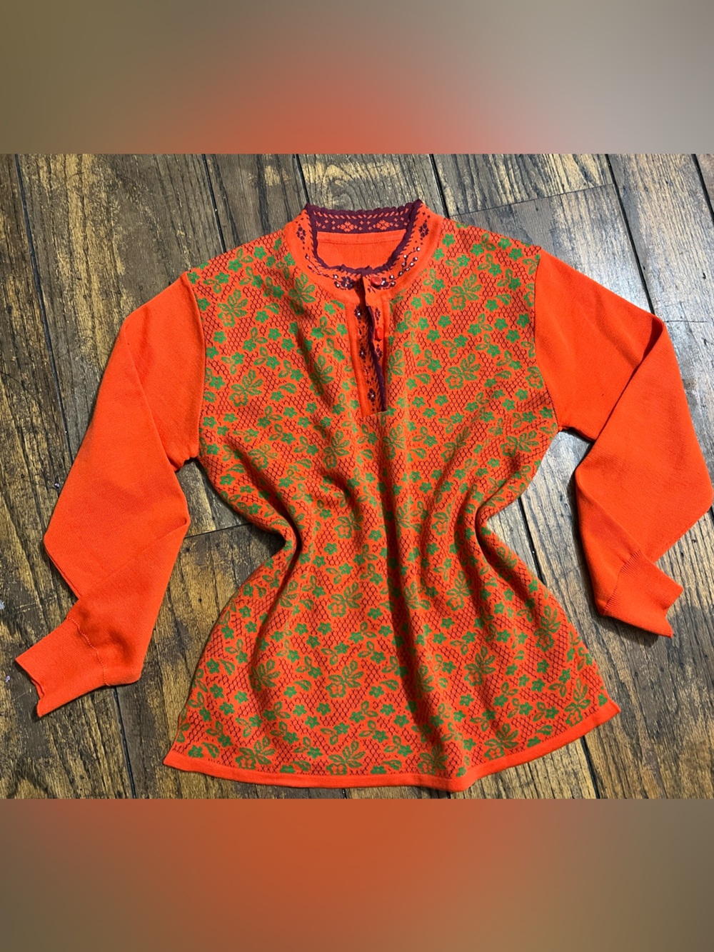 Orange Knit Sweater with Green Floral Pattern